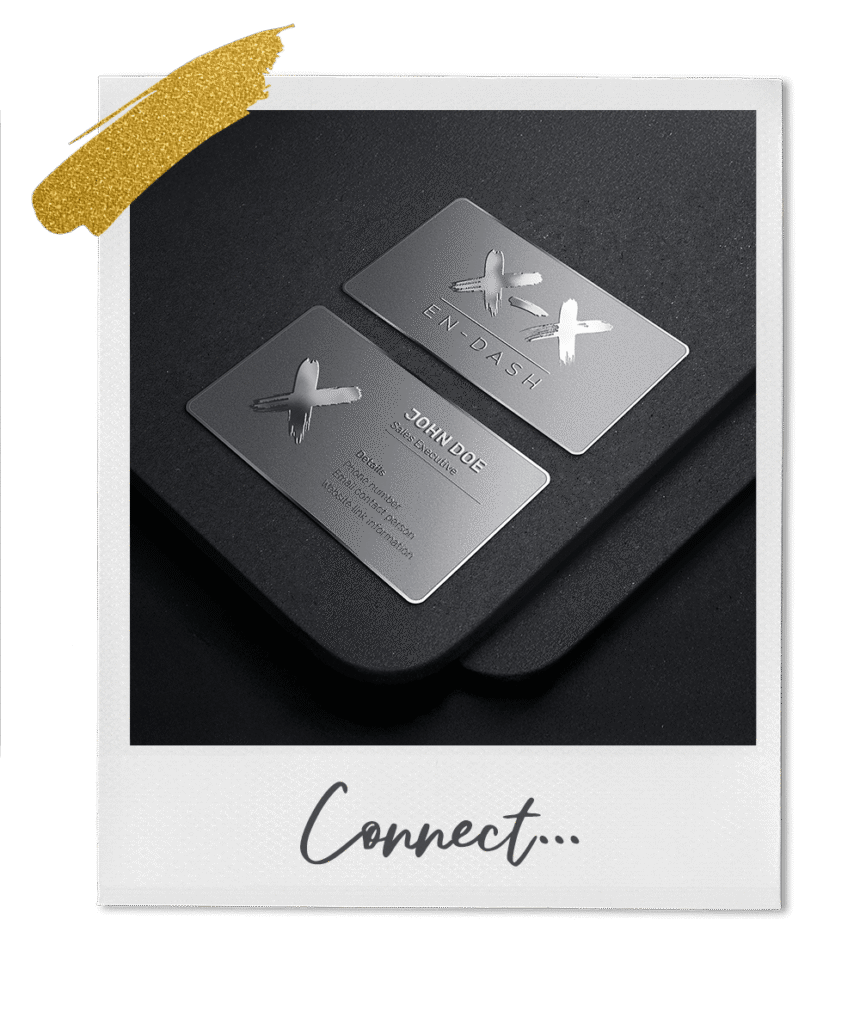 Silver business cards on black surface